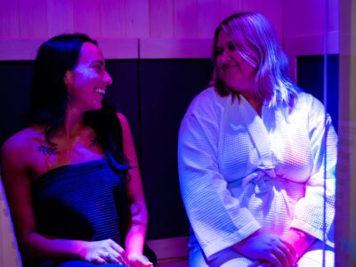 A Couple Of People That Are Sitting On A Stage